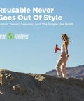No Sweat Wide Mouth Stainless Steel Water Bottle With Loop Cap 40 Oz Non Insulated Bpa Free Dishwasher Safe Brushed Finish held by a woman outdoors.