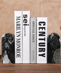 Sturdy Marble Book Ends Set Weighing 7lbs With Non Slip Pads for Stable Shelf Display holding books upright on a shelf