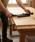 Person using an Adjustable Aluminum Dowel Jig Drill Guide Drops Dead Nuts Precision for Furniture Assembly and Cabinet Work.