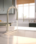 hansgrohe Talis N Pull Down Kitchen Faucet, Modern, Magnetic Hand Sprayer, 1-Handle, 1.75 GPM, Polished Nickel, 72865831 with flowing water.