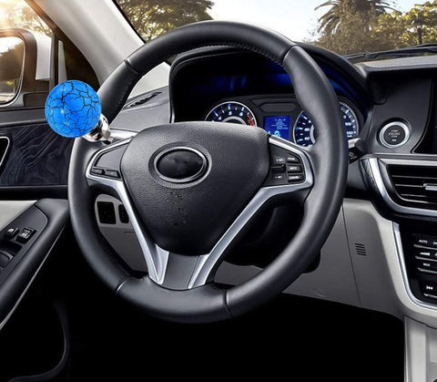 Ball Steering Wheel Knob Spinner for One Hand Driving Aid, marbled blue power handle grip, installed on car steering wheel.