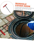 Heavy Duty Multi Function Manhole Cover Lifter With Thick T Shaped Handle For Roller Shutters And Sliding Doors Top Notch No Sweat Pulling Tool Set Pro Grade with red handle and hook over manhole.