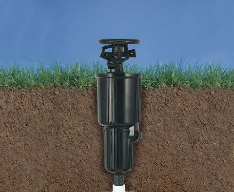 Pulse Go-To Pop-Up Impact Sprinkler Head Black 3-Inch Riser Adjustable Spray showing underground installation with grass