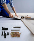Person using Floor Squeak Repair Kit For Wood, Carpet, Hardwood, Vinyl Eliminates Squeaks And Secures Floors To Joists With Precision Tools
