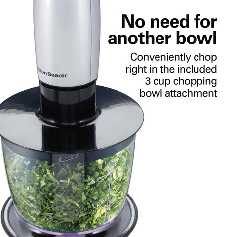 Kickass 4 In 1 Electric Immersion Hand Blender With Whisk And 3 Cup Vegetable Chopper Bowl showing chopped herbs in bowl attachment.