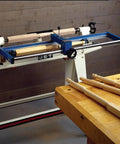 Woodturning Lathe Duplicator Attachment For Floor Model Lathes Lets You Reproduce Precise Spindles Table Legs And Turned Pieces Up To 39 Inches With A Smooth Hand Wheel Easy Mount And Reliable High Quality Craftsmanship, shown mounted on a lathe with wooden spindles.