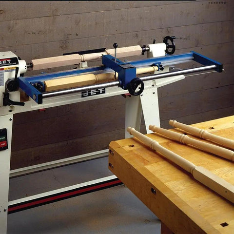 Woodturning Lathe Duplicator Attachment For Floor Model Lathes Lets You Reproduce Precise Spindles Table Legs And Turned Pieces Up To 39 Inches With A Smooth Hand Wheel Easy Mount And Reliable High Quality Craftsmanship, shown mounted on a lathe with wooden spindles.