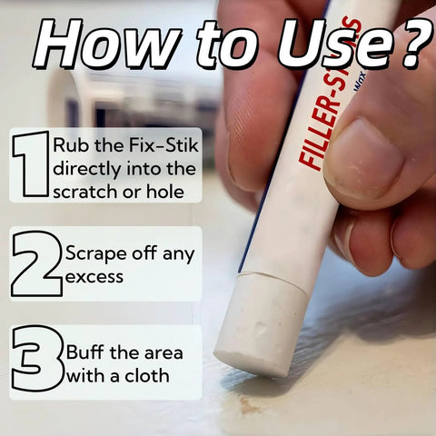 Close-up of a hand using Wood Repair Wax Sticks For Scratches And Dents In Furniture Floors Cabinets And Doors Seamless Color Match Easy Filling Cracks And Nail Hole Repair 5 Pack on a surface, showing application steps.