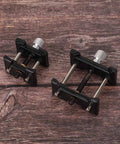 Two Piece Watch Movement Holder Kit With Non Slip Fixed Base and Plastic Repair Tool on wooden surface