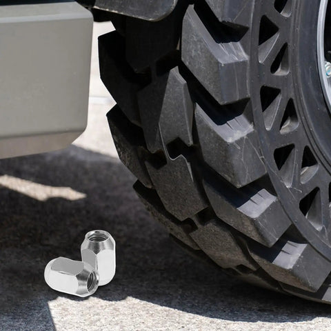 Heavy Duty ATV Lug Nut Kit With M10x1.25 Bolts For 10 Inch 12 Inch And 14 Inch Wheels, Premium Stainless Steel Quick Replacement Set Perfect For UTV Mud Trails And Beach Rides To Keep Your Quad Locked Down Secure. stainless steel lug nuts beside ATV wheel