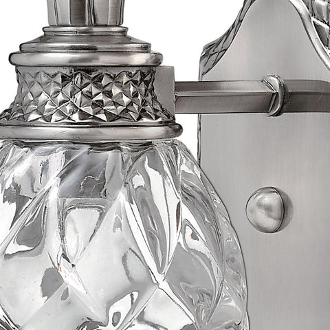 Close-up of Plantation Style One Light Bathroom Vanity Fixture in Polished Antique Nickel with Silver Patina Finish, showing glass detail.