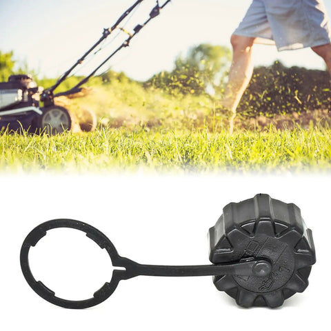 Heavy Duty Sprayer Tank Drain Covers With Secure Tether And Quick Emptying Threaded Caps Fits Most Sprayers No Fuss Mud Proof Design For Seasonal Storage And Post Application Rinse With Corrosion Resistant Threads in front of a lawn mower on grass