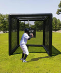Teen practicing in Inflatable Batting Cage For Baseball And Softball, Instant Pop-Up 10 Ft By 10 Ft By 10 Ft Backyard Training Cage