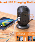 12 In 1 Tower Power Strip With 8 Outlets And 4 USB Ports, 10 Ft Extension Cord, 1050J Surge Protector on desk charging devices