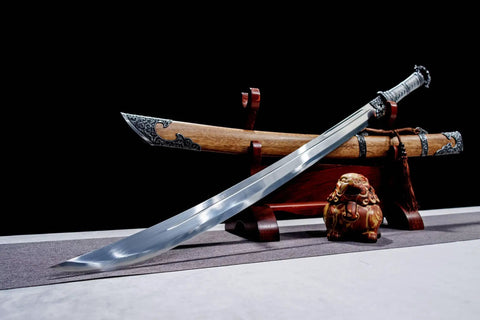 Xiuchun Dao Chinese Sabre Hand Forged Manganese Steel With Teak Wood Scabbard And Textured Alloy Fittings displayed on stand