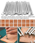 Leatherworking tool set with knurled metal punches and storage bag; front view showing assorted stamping heads.