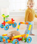 No Fuss Learning 156 Piece Pipe Building Blocks Set with kid pushing colorful toy car made of interlocking tubes.