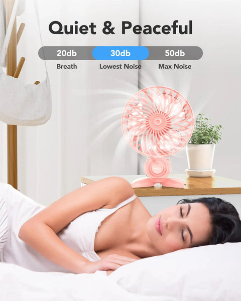 USB Desk Fan With CVT Variable Speeds on bedside table, pink, providing quiet airflow for sleeping woman.
