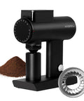 Timemore Sculptor 078S Electric Coffee Bean Grinder with Flat Burrs and ground coffee pile, used for espresso and pour over.
