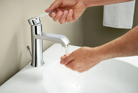 Washing hands under Genta LX Chrome One Handle Modern Bathroom Sink Faucet With Optional Deckplate And Low Arc Spout