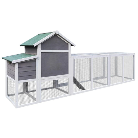 Spacious Wooden Chicken Coop And Rabbit Hutch For Outdoors With Nesting Box, waterproof roof, and sliding door in backyard setting.
