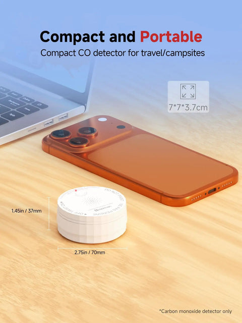 Smart Carbon Monoxide Detector With No Hassle Real Time App Alerts And 2.4 GHz Wi Fi For Home Travel And RV Portable Battery Powered CO Alarm UL 2034 5th Edition ETL Listed FCC Certified 85 dB Test Button, shown next to smartphone.