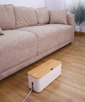 Dual Cable Management Box Set with Small and Large White Cord Hiders for desk or home office use placed on wooden floor