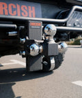 Adjustable Trailer Hitch With 360 Degree Swivel Tri Ball Mount And Tow Hook Lock, Rotating 3 In 1 Ball System For 1 7/8, 2, And 2 5/16 Inch Balls, Rated Up To 15,000 Lbs GTW And 10,000 Lbs Tow Hook. Black steel tri-ball hitch mounted on a truck receiver.