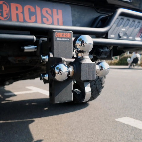 Adjustable Trailer Hitch With 360 Degree Swivel Tri Ball Mount And Tow Hook Lock, Rotating 3 In 1 Ball System For 1 7/8, 2, And 2 5/16 Inch Balls, Rated Up To 15,000 Lbs GTW And 10,000 Lbs Tow Hook. Black steel tri-ball hitch mounted on a truck receiver.