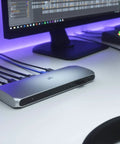 Thunderbolt 3 Dock For Laptop Users Delivers Snazzy Desk Setups With 85W Fast Charging, showing a sleek silver docking station on a workspace.