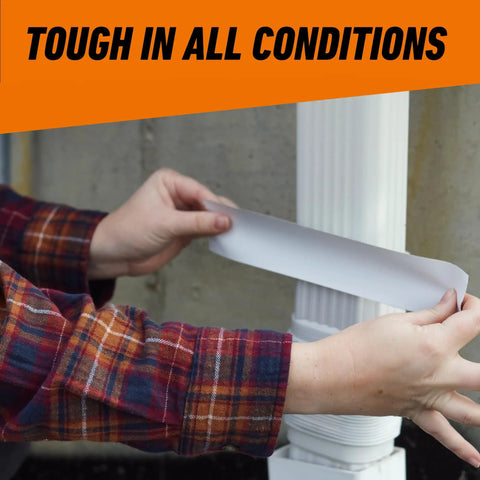 Applying Heavy Duty White Duct Tape 1.88 Inch Wide, 30 Yard Roll Pack Of 2 to outdoor pipe, showing its UV resistant feature.