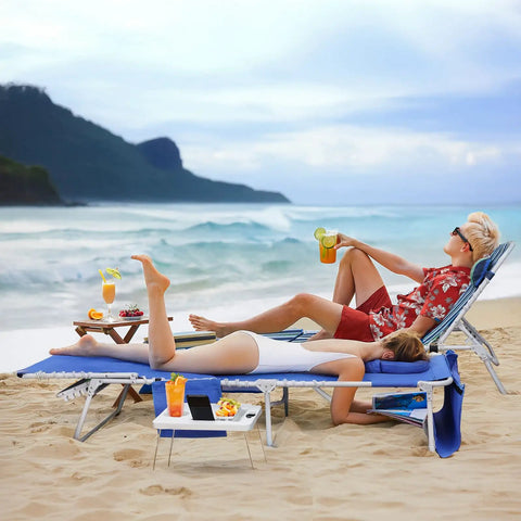 People relaxing on a 3-In-1 Beach Chair With Face Holes And Folding Side Table Outdoor Lounger With 5-Position Recliner Lay Flat Mode on a beach