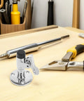 Rugged Polished Silver Stainless Steel Boat Yacht Marine Door Stopper Catch on workbench surrounded by tools.