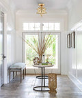 Modern Sleek Brass Moravian Star Ceiling Light Mini Semi Flush Mount With 8 Inch Seeded Glass in an entryway