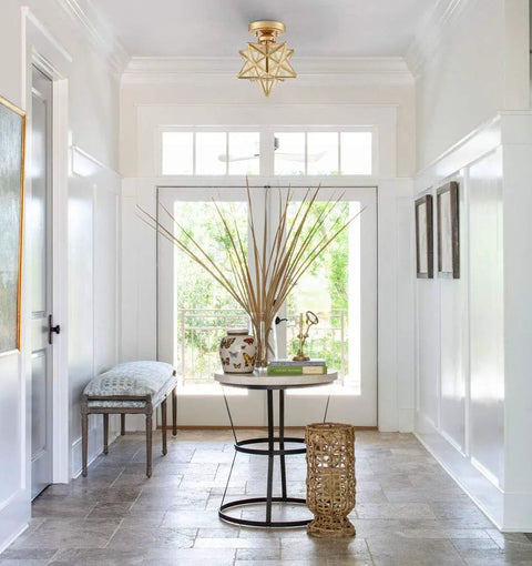 Modern Sleek Brass Moravian Star Ceiling Light Mini Semi Flush Mount With 8 Inch Seeded Glass in an entryway