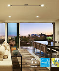 Modern living room with Ultra Slim 4 Inch LED Recessed Downlights With J Box Pack Of 6 illuminating the space, view outside.