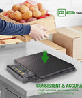 Heavy Duty 400 Pound Digital Receiving Scale With Anti Slip Aluminum Platform For Restaurant And Catering High Accuracy Kitchen Food Scale With Hold Tare Auto Off Dual Unit Kg Lb And Large LCD Display on a counter weighing potatoes in a crate.