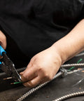 Person using 6-1/4 Inch Wire Stripper And Cutter With No-Fuss Durable Blue Handles For Electrical Wiring, precise cutting action