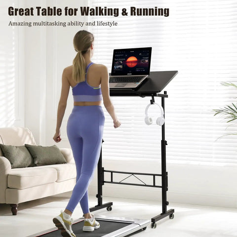 Total Game Changer Small Height Adjustable Standing Desk With Tiltable Tabletop And Smooth Rolling Wheels Customized For Remote Workers And Gamers Who Want Flexible Setup Vibes And Rock Solid Stability with a laptop and headphones.