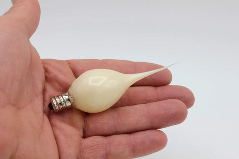 Country Style Incandescent Silicone Dipped Candle Light Bulbs With Pearlized Finish, 5 Watt bulb held in a hand for scale.