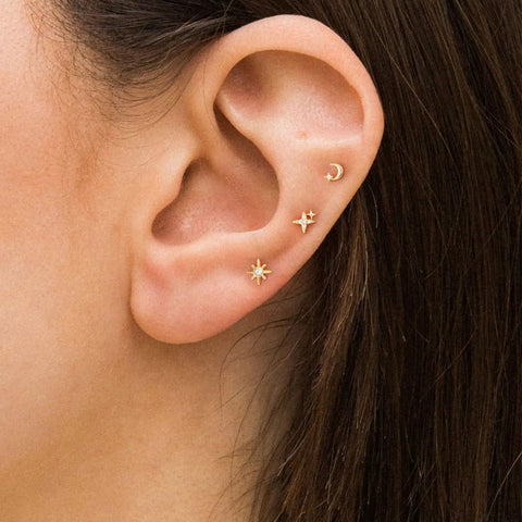 Hypoallergenic Flat Back Earrings For Women 14K Gold Plated Mini Stud Set Of 3 Pairs Featuring Star Moon Sun Shapes Flat Back Cartilage Helix Piercing Jewelry Includes 4mm And 5mm Sizes For Daily Mix And Match. Moon, star and sun flat back studs on ear
