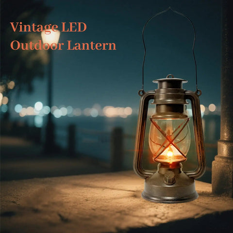 Vintage LED Outdoor Lantern With Dancing Flame Wick on stone surface at night, glowing softly in the dark, bronze finish.