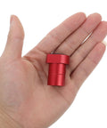 Red aluminum peg from 8 Pack Workbench Pegs With Nonslip Surface And Quick Release For Woodworking Projects held in hand