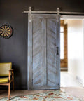 Six And A Half Inch Black Pulls Two Pack For Barn Doors installed on a wooden sliding door with vintage black handle