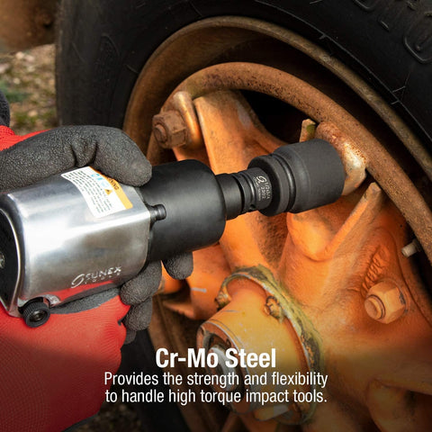 Side view of a black 1/2in to 3/8in Cr-V impact adapter on an impact wrench used on a rusty wheel hub.