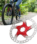 Mountain Bike Disc Brake Rotor And Pads 203mm Five Bolt Build With Stainless Steel Outer And Aluminum Inner For Hydraulic Mechanical Brakes, showing red rotor and cyclist.