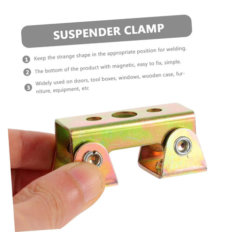 Hand holding a suspender clamp made of colored metal with magnetic bottom for welding alignment and secure holding.