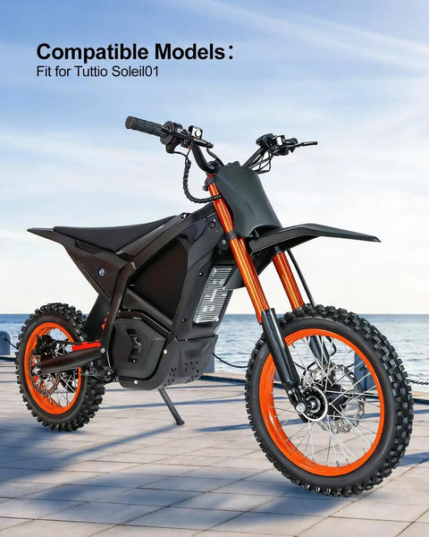 Electric dirt bike with visible orange rims, compatible with Tuttio Soleil, shown on outdoor pavement.