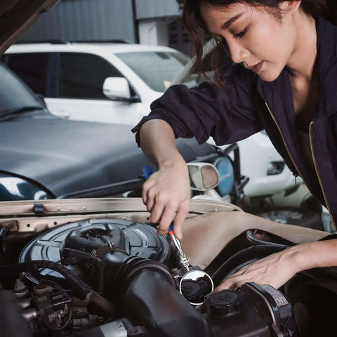 Mechanic using Four Piece Telescoping Magnetic Pick Up Tool Kit With Flexible Grabber A Real Workhorse For Reaching Under Cars Two Magnetic Pick Up Tools 2 Lb And 16 Lb And Four Claw Grabbers Plus Telescoping Inspection Mirror For Auto Repair And Car Maintenance to inspect car engine.
