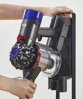 Person mounting Dyson V6 on Must Have Docking Station Replacement Wall Mount Bracket For Dyson V6 Series Vacuums Compatible DC58 DC59